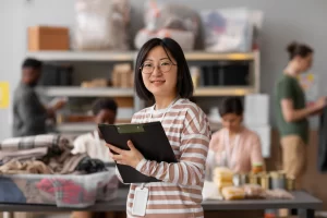 Volunteer Organizing Donations Charity - Souza